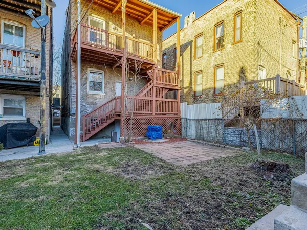 a view of a building with a yard
