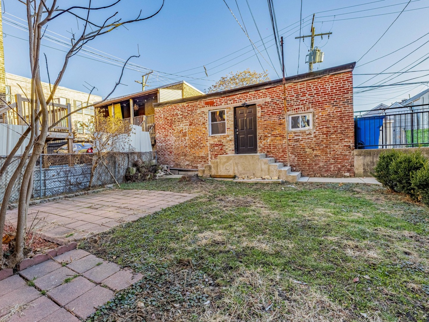 1621 West Cullerton Street, Unit 2 Chicago, IL 60608 - Photo 16 of 17 a view of a house with a yard