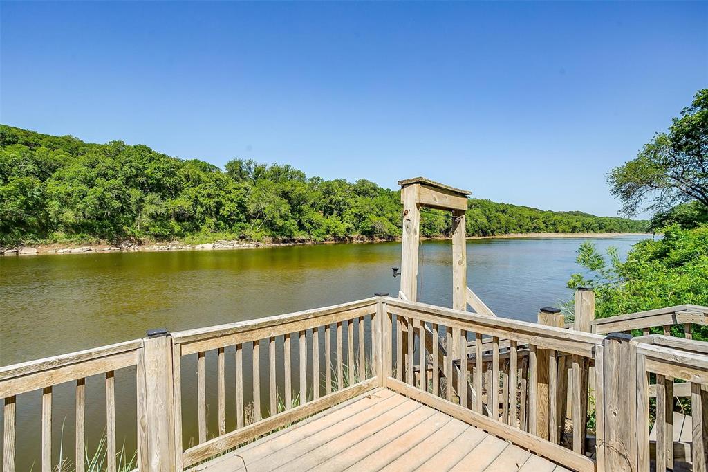 9310 Bellechase Road Granbury, TX 76049 - Photo 38 of 39 a balcony with an ocean view