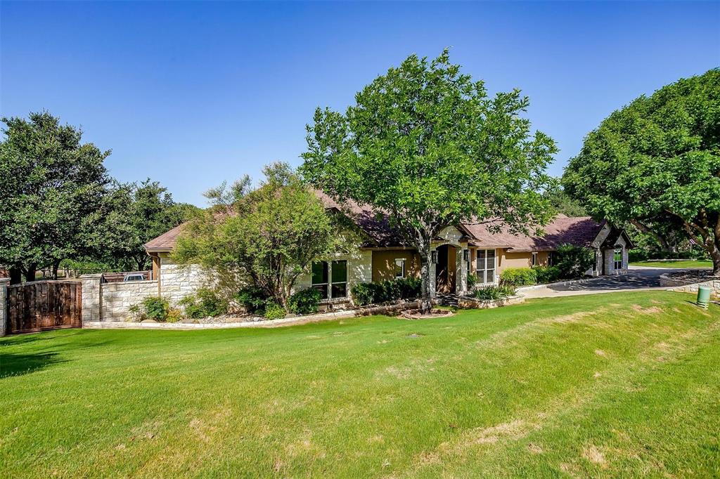 9310 Bellechase Road Granbury, TX 76049 - Photo 5 of 39 a front view of house with yard and green space