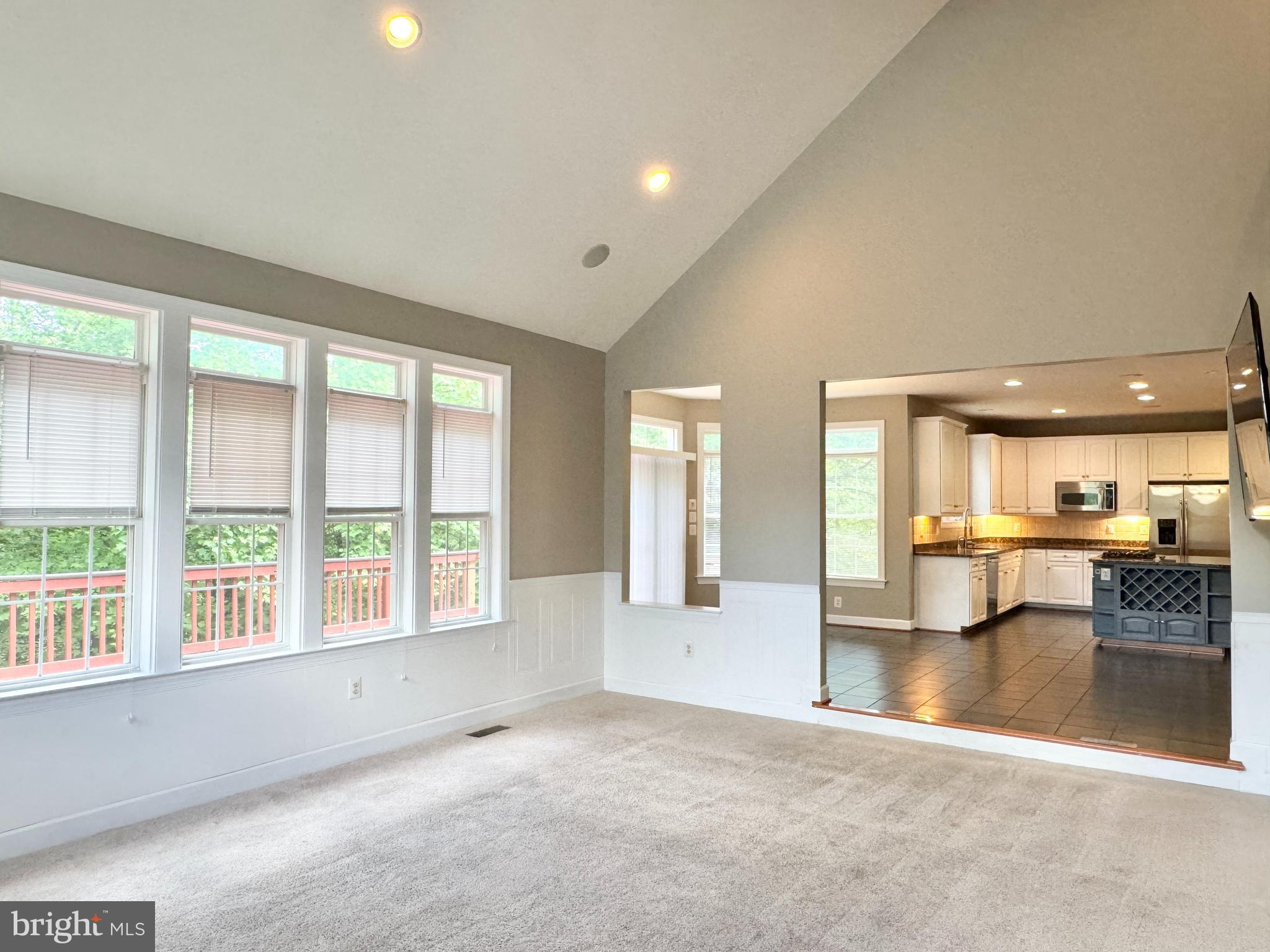 3500 Germainia Court Triangle, VA 22172 - Photo 11 of 77 an empty room with large windows and view of kitchen