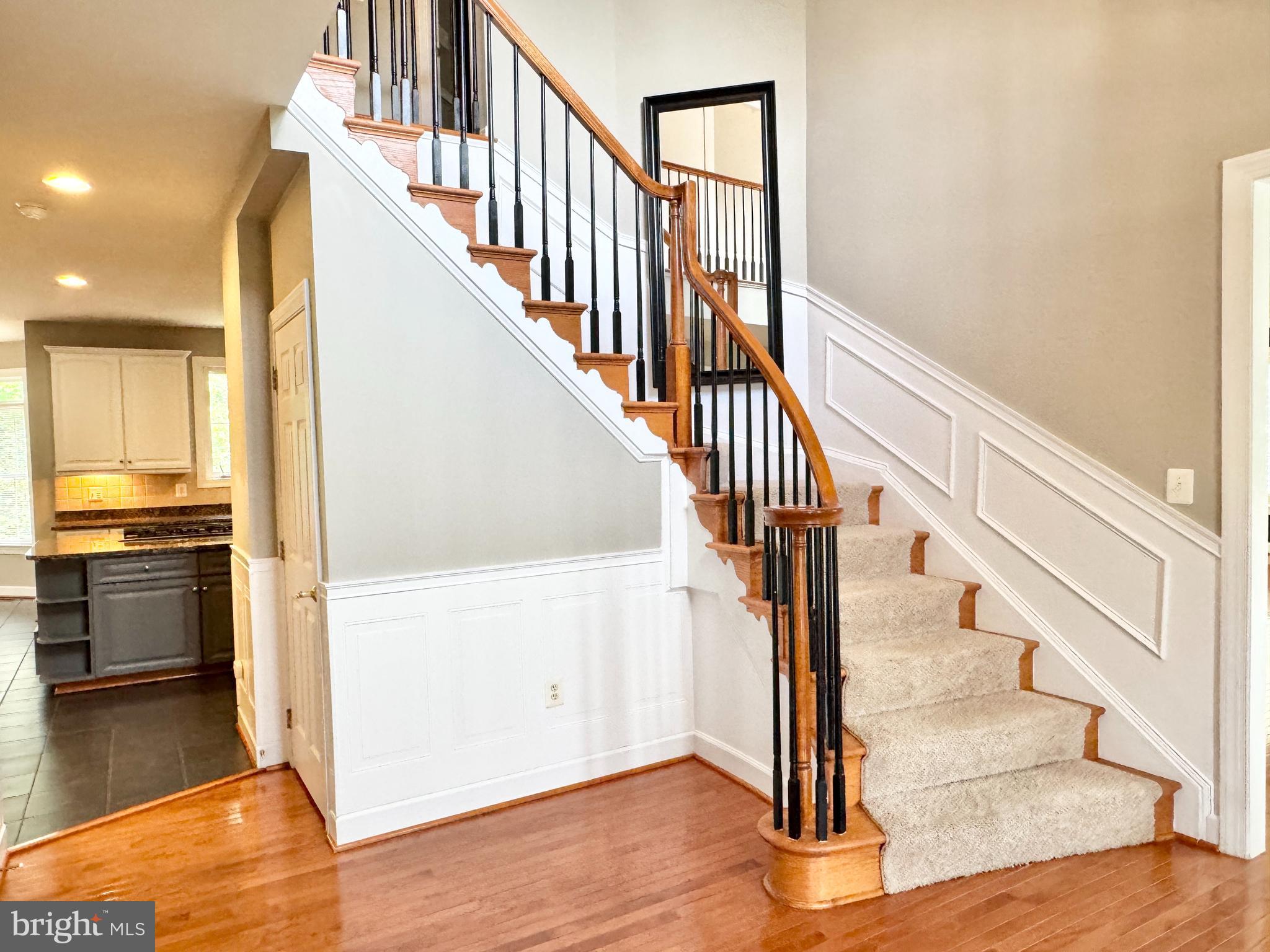 3500 Germainia Court Triangle, VA 22172 - Photo 16 of 77 a view of hallway with wooden floor and kitchen view