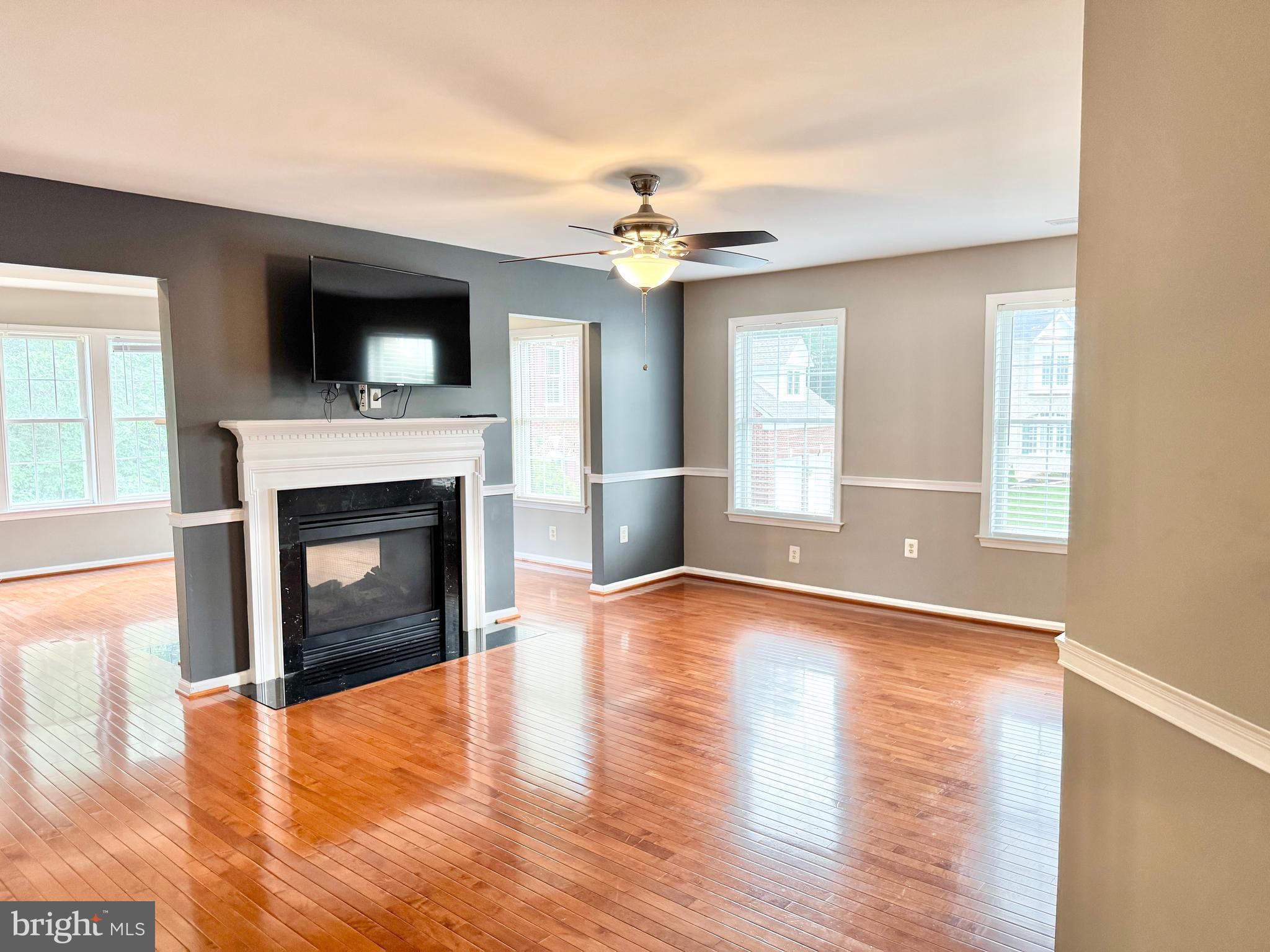 3500 Germainia Court Triangle, VA 22172 - Photo 30 of 77 a view of a livingroom with a fireplace wooden floor and chandelier