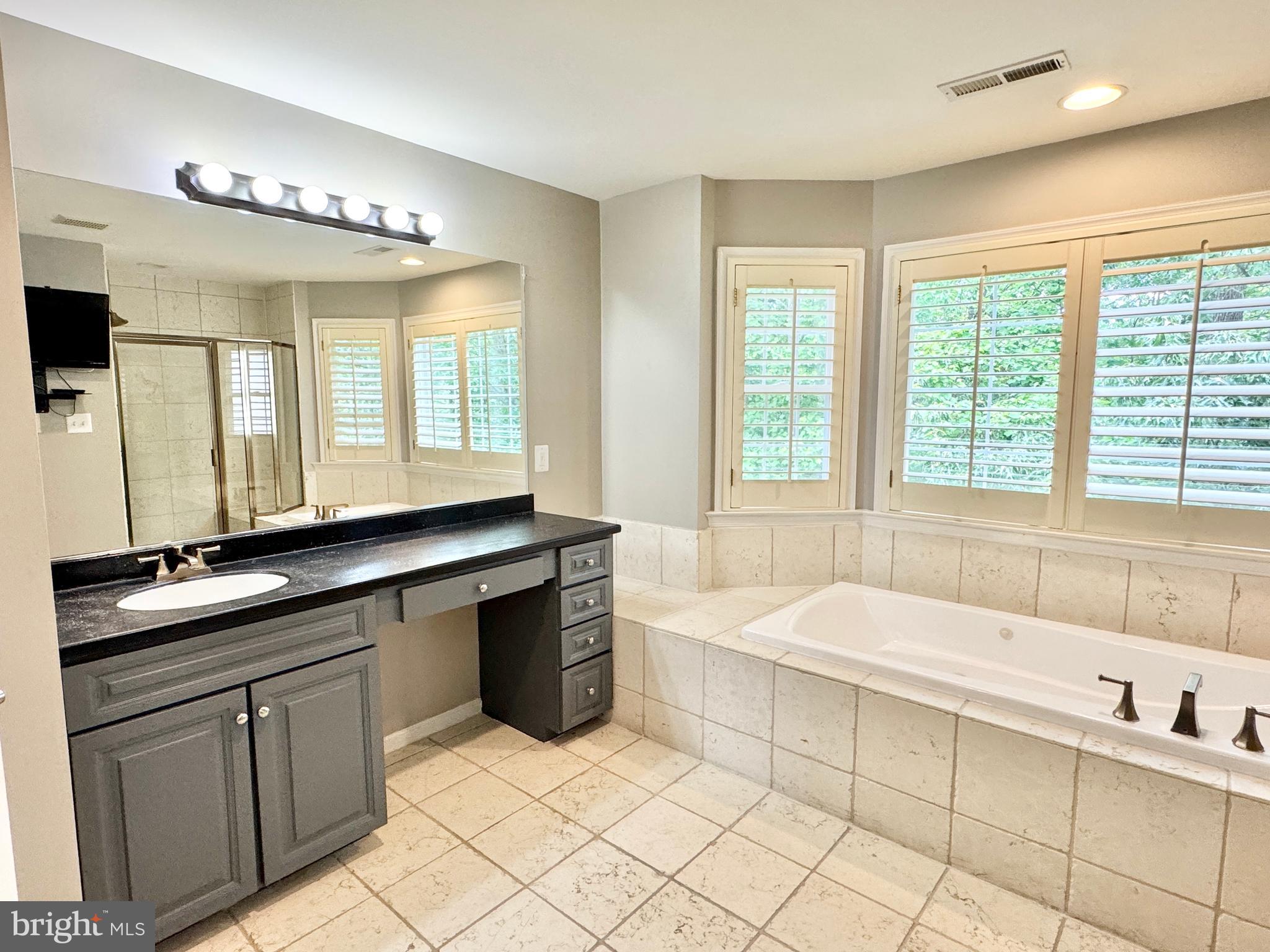 3500 Germainia Court Triangle, VA 22172 - Photo 37 of 77 a spacious bathroom with a large tub sink and mirror