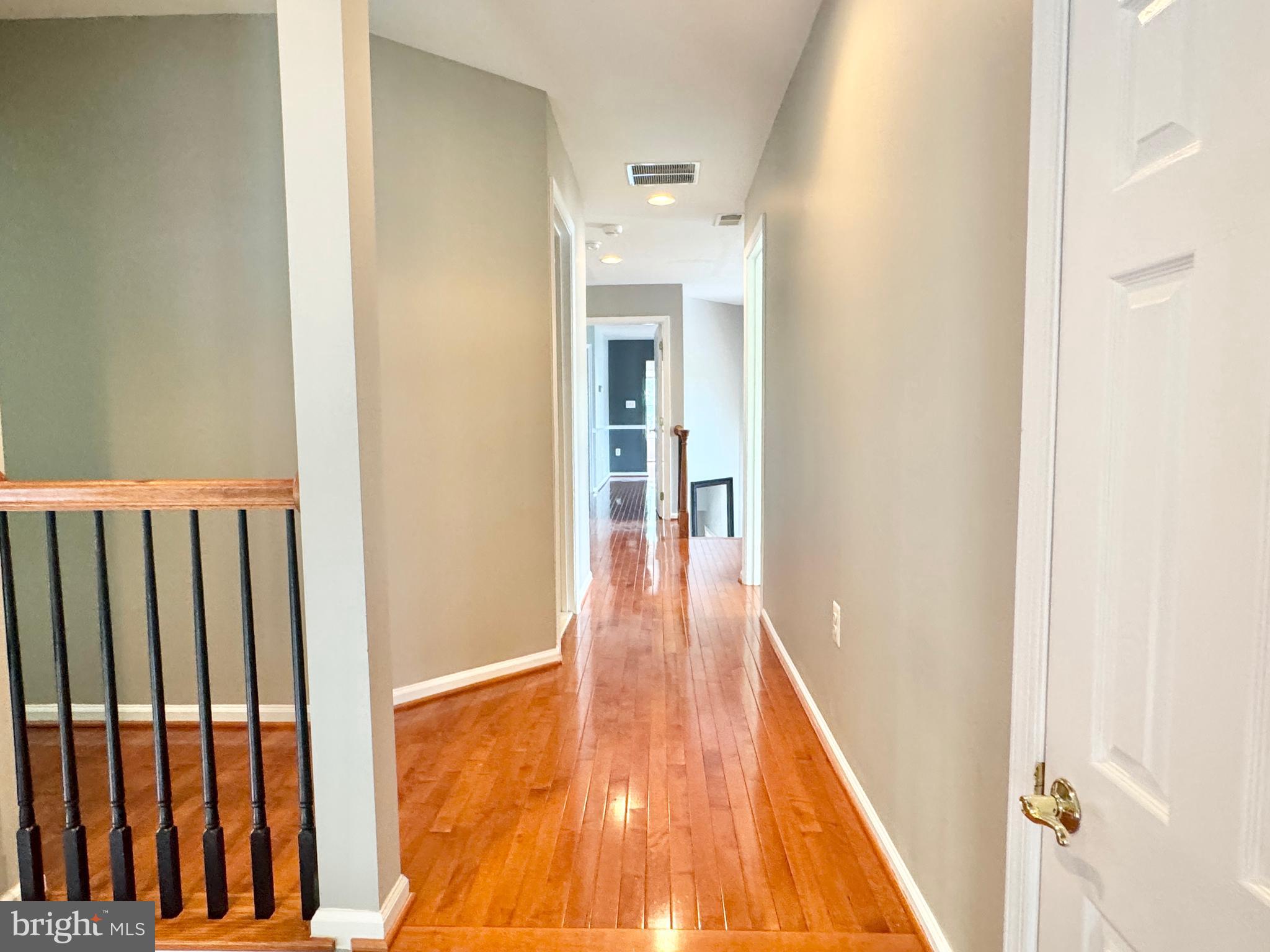 3500 Germainia Court Triangle, VA 22172 - Photo 52 of 77 a view of a hallway with wooden floor and staircase