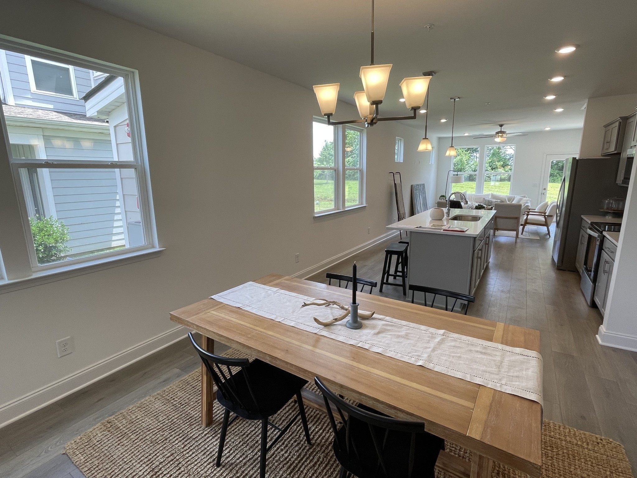 1146 June Wilde Ridge Spring Hill, TN 37174 - Photo 4 of 18 a view of a dining room with furniture window and wooden floor