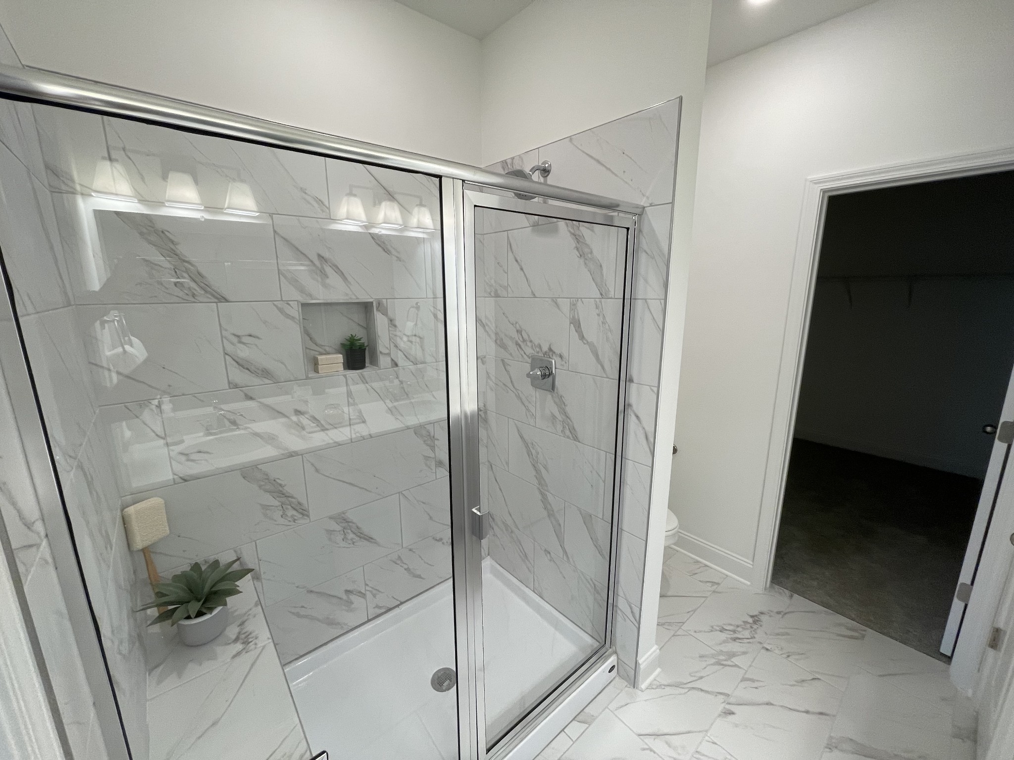 1146 June Wilde Ridge Spring Hill, TN 37174 - Photo 9 of 18 a bathroom with a glass shower door