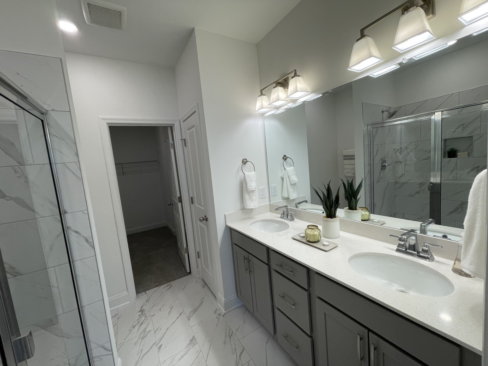 1146 June Wilde Ridge Spring Hill, TN 37174 - Photo 10 of 18 a bathroom with a double vanity sink and a mirror