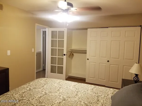 a bedroom with a bed and a window