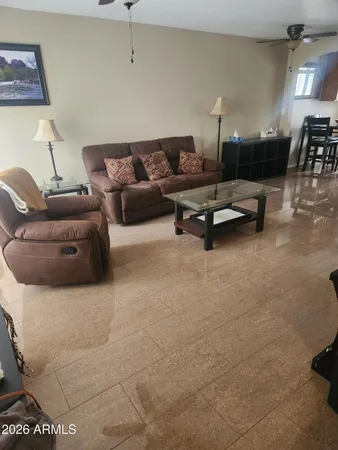 a living room with furniture and a table