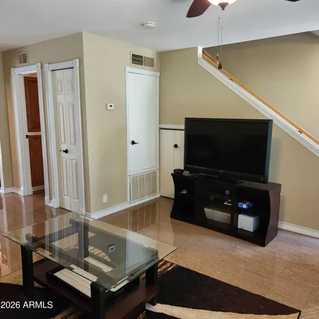 a living room with couch and a flat screen tv