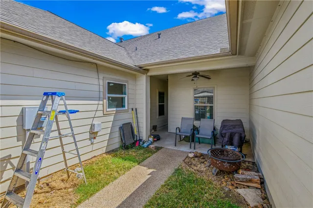 a backyard of a house with seating space