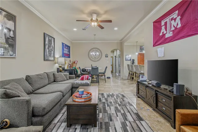 a living room with furniture and a flat screen tv