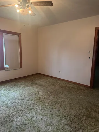 a stove top oven sitting inside of a kitchen