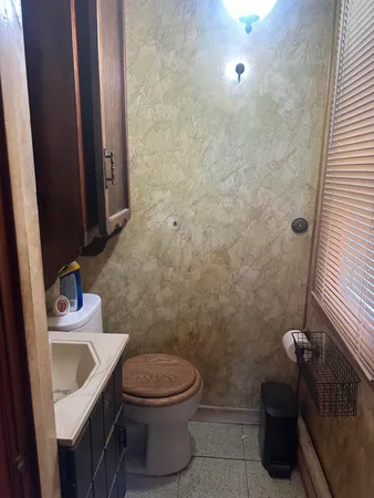 a kitchen with stainless steel appliances granite countertop wooden cabinets a refrigerator and a sink