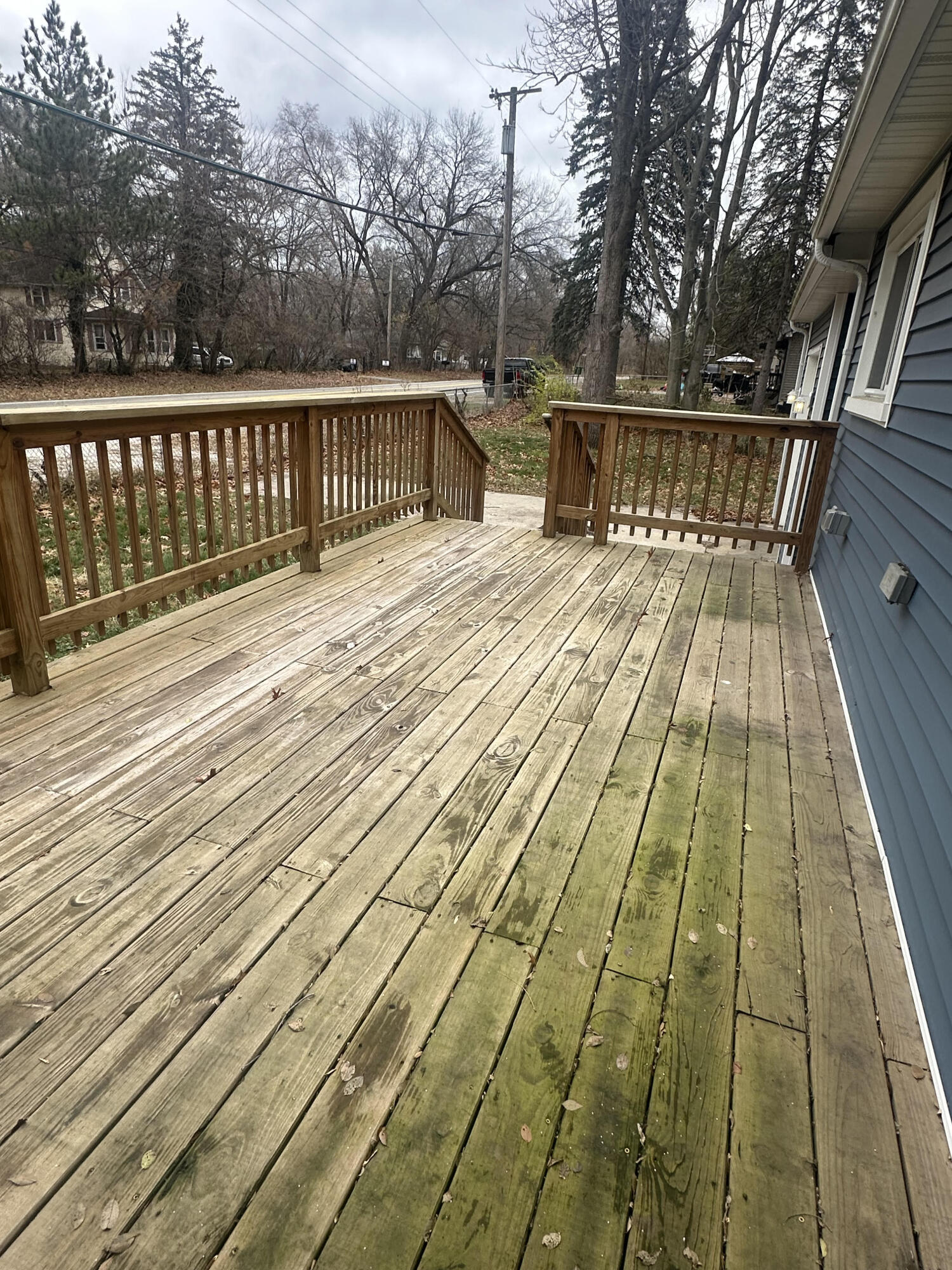 5489 Clem Road Portage, IN 46368 - Photo 4 of 48 a view of balcony with wooden floor and fence