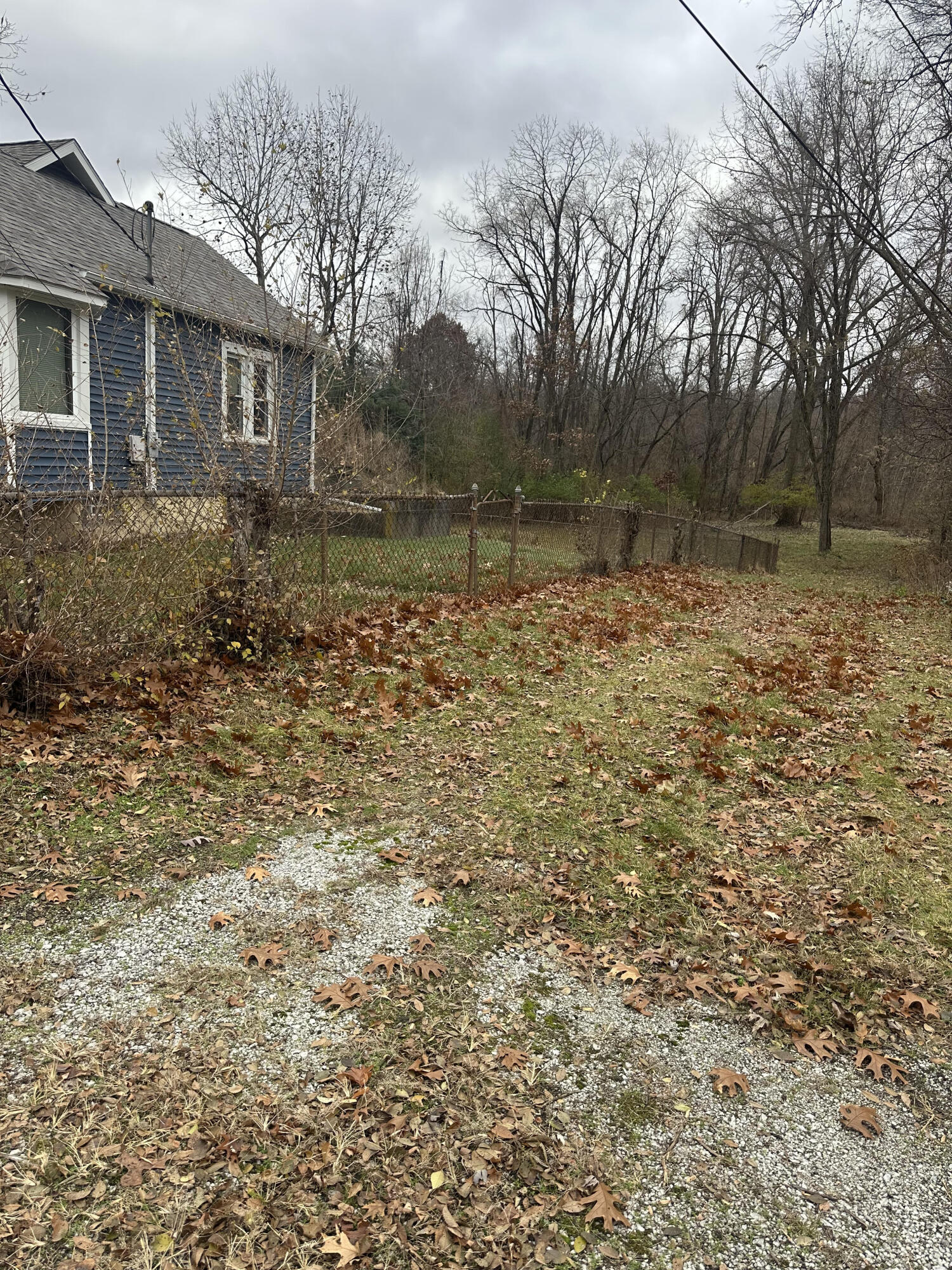 5489 Clem Road Portage, IN 46368 - Photo 6 of 48 a backyard of a house with large trees
