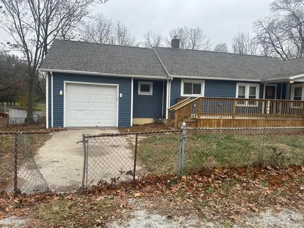 a house view with a backyard space