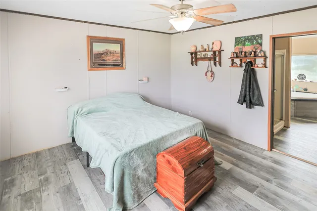 a bed room with a bed and a chandelier