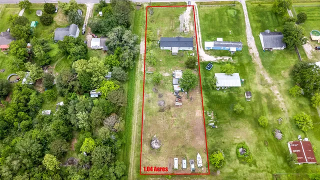a aerial view of a house with a yard