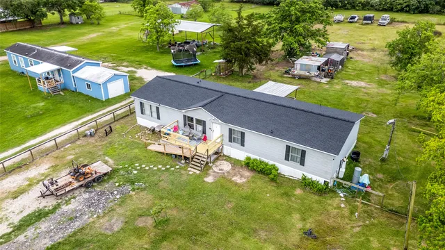 a front view of house with yard and outdoor seating