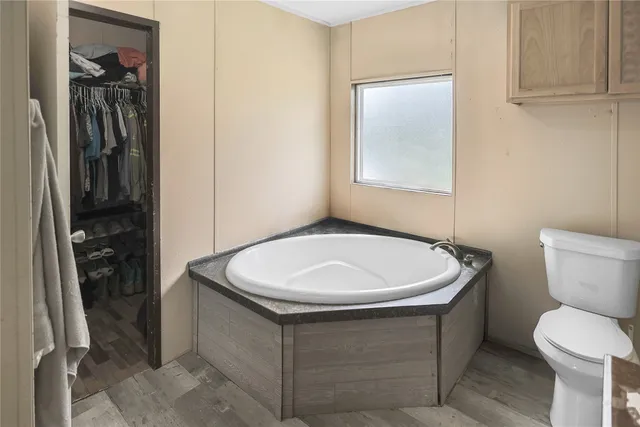 a bathroom with a sink a toilet and a shower