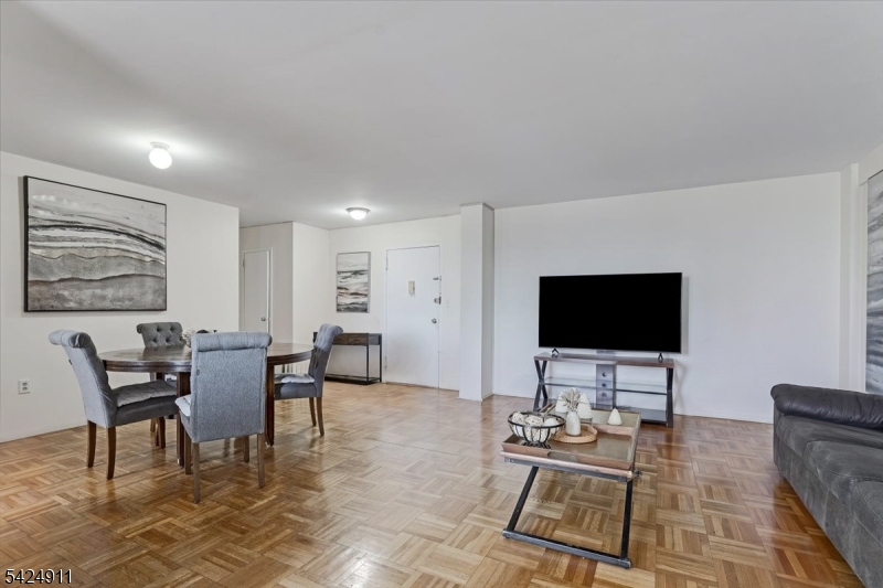 90 Prospect Avenue Hackensack, NJ 07601 - Photo 3 of 21 a view of a livingroom with furniture and a flat screen tv
