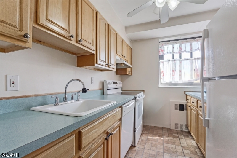 90 Prospect Avenue Hackensack, NJ 07601 - Photo 5 of 21 a kitchen with stainless steel appliances granite countertop a sink and cabinets