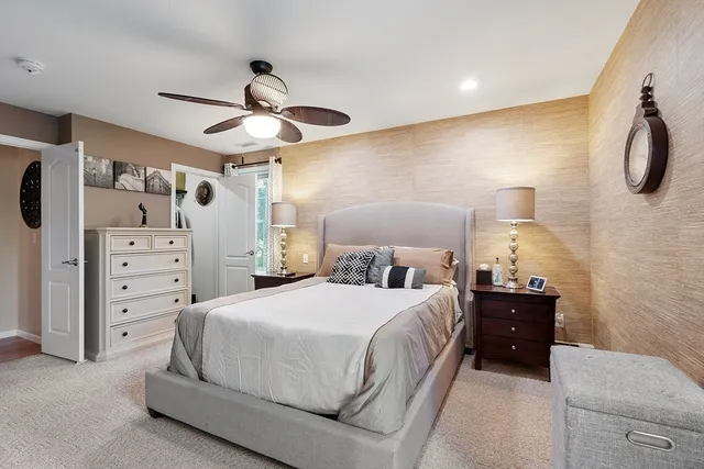a bedroom with a bed and cabinets
