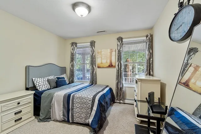 a bedroom with furniture and a window