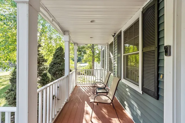 a view of balcony with furniture