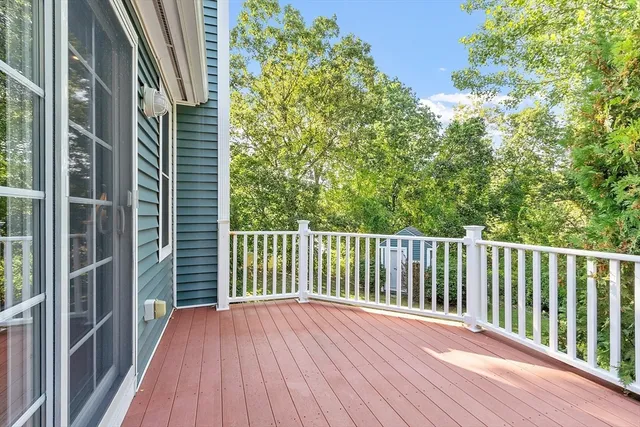 a view of balcony with wooden floor