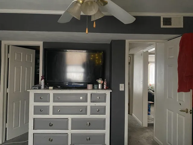 a room with furniture and flat screen tv