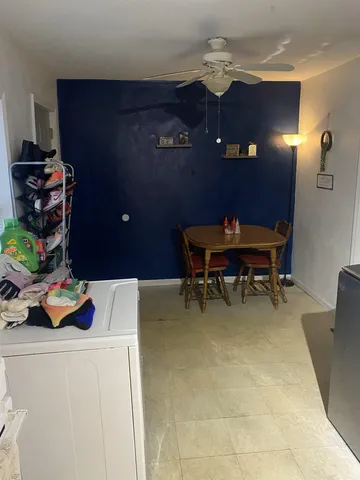 a workspace with furniture and a chandelier