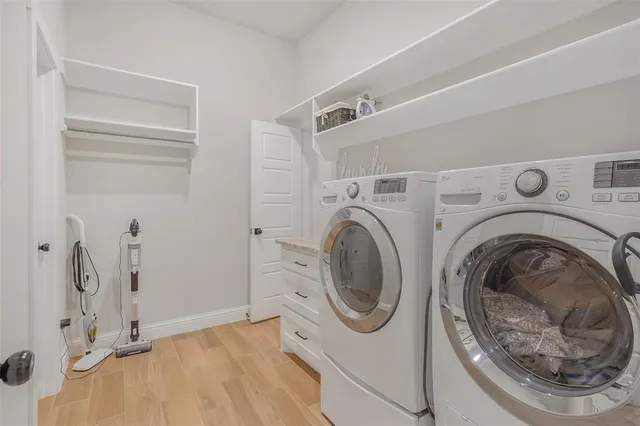 a utility room with dryer and washer