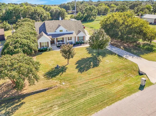 a view of residential houses with outdoor space and swimming pool