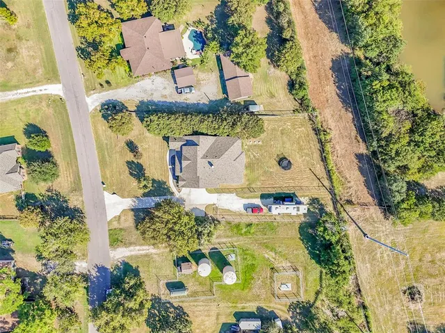 an aerial view of residential houses with outdoor space