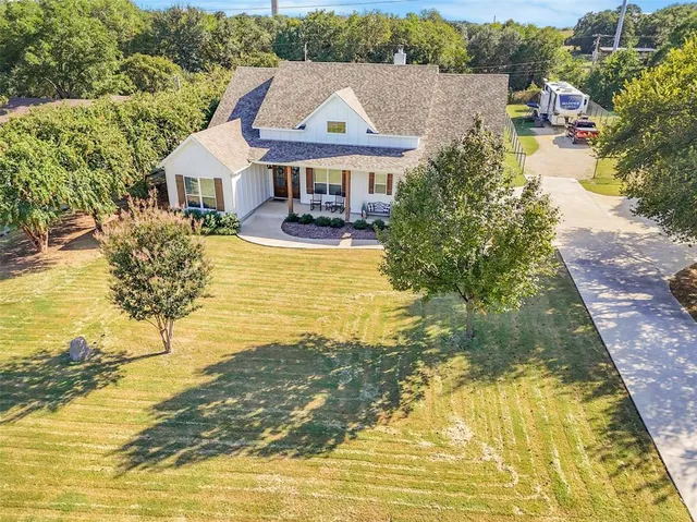 a aerial view of a house with swimming pool