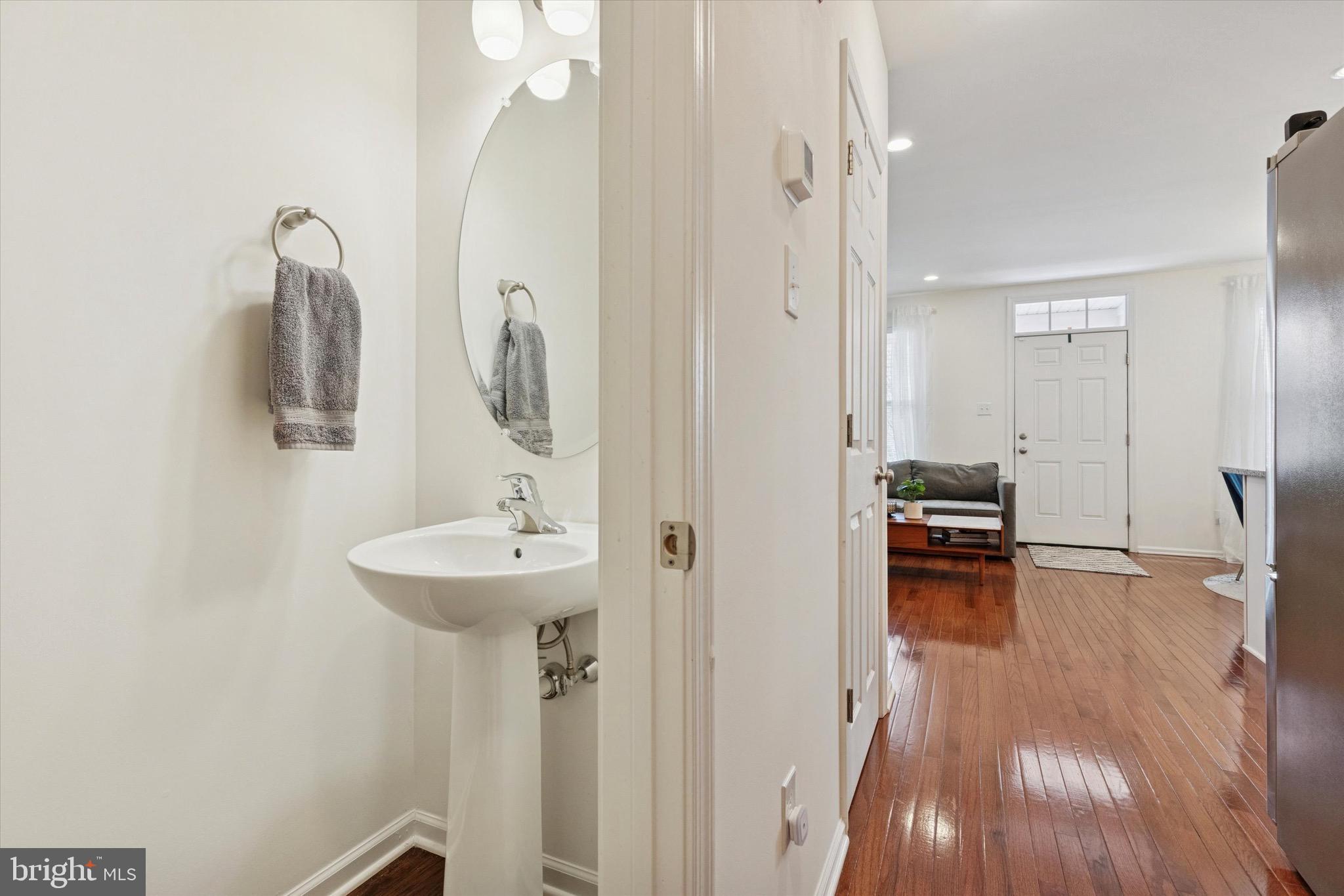 1529 DeKalb Street, Unit 131 Norristown, PA 19401 - Photo 11 of 27 a bathroom with a sink mirror and shower