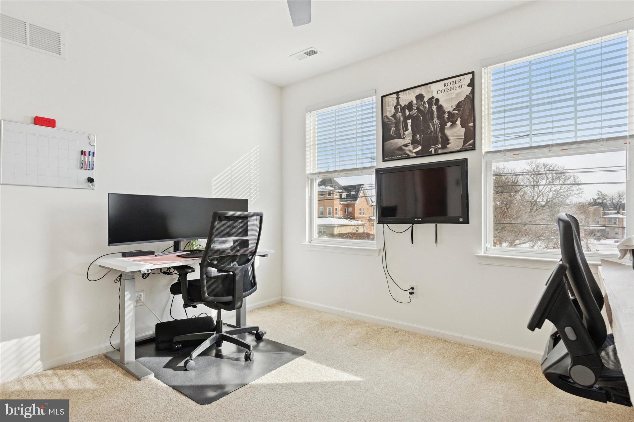 1529 DeKalb Street, Unit 131 Norristown, PA 19401 - Photo 13 of 27 a view of a workspace with furniture and a window