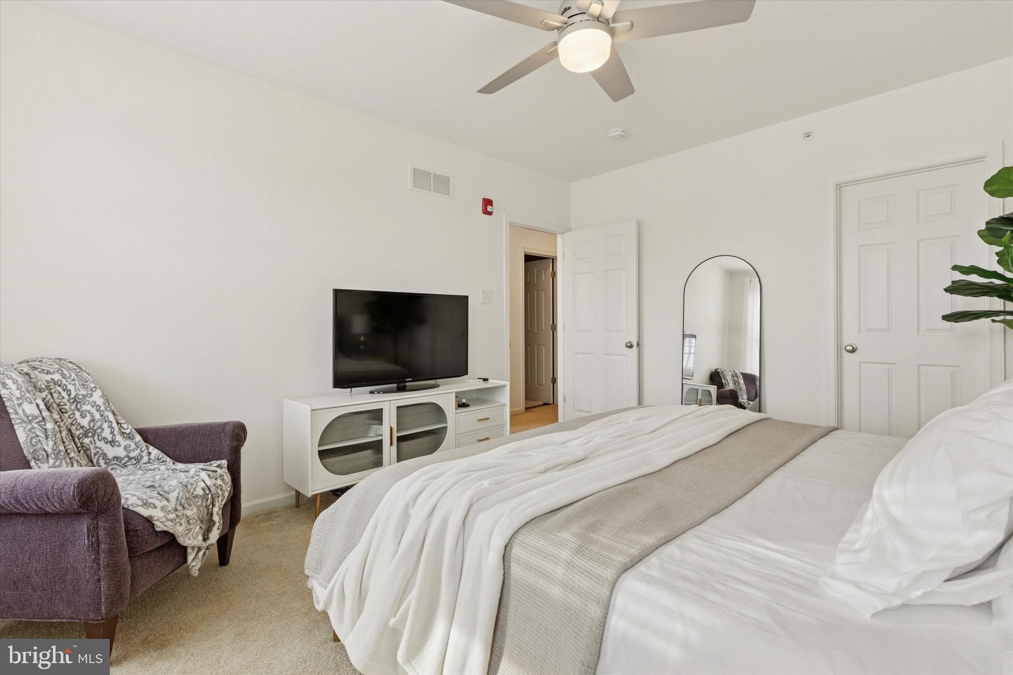 1529 DeKalb Street, Unit 131 Norristown, PA 19401 - Photo 18 of 27 a bedroom with bed and a flat screen tv