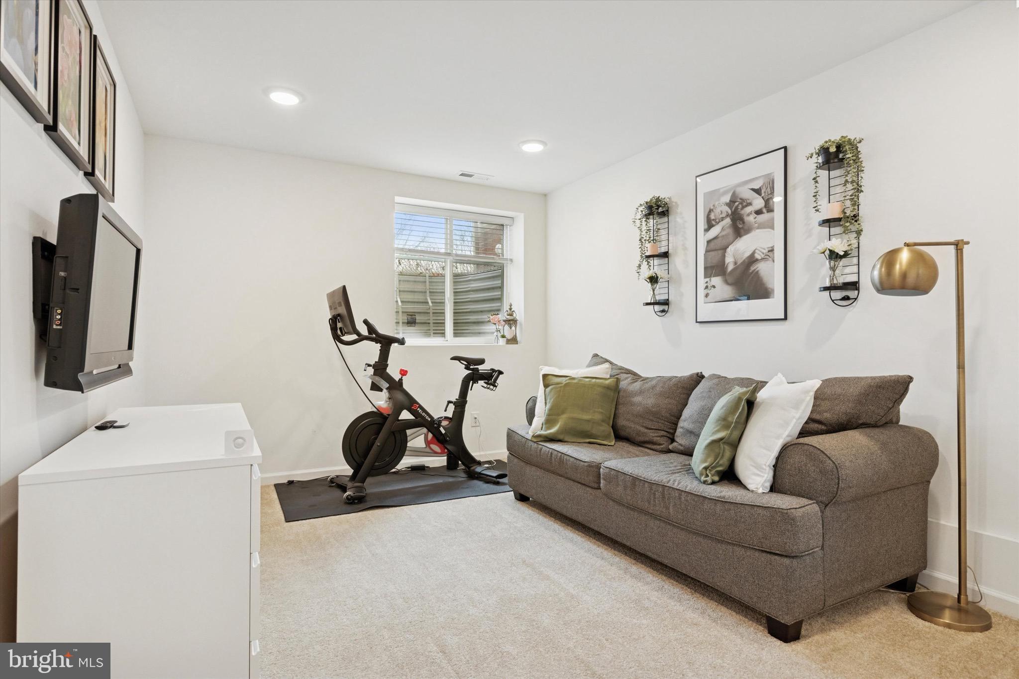 1529 DeKalb Street, Unit 131 Norristown, PA 19401 - Photo 21 of 27 a living room with furniture and a flat screen tv