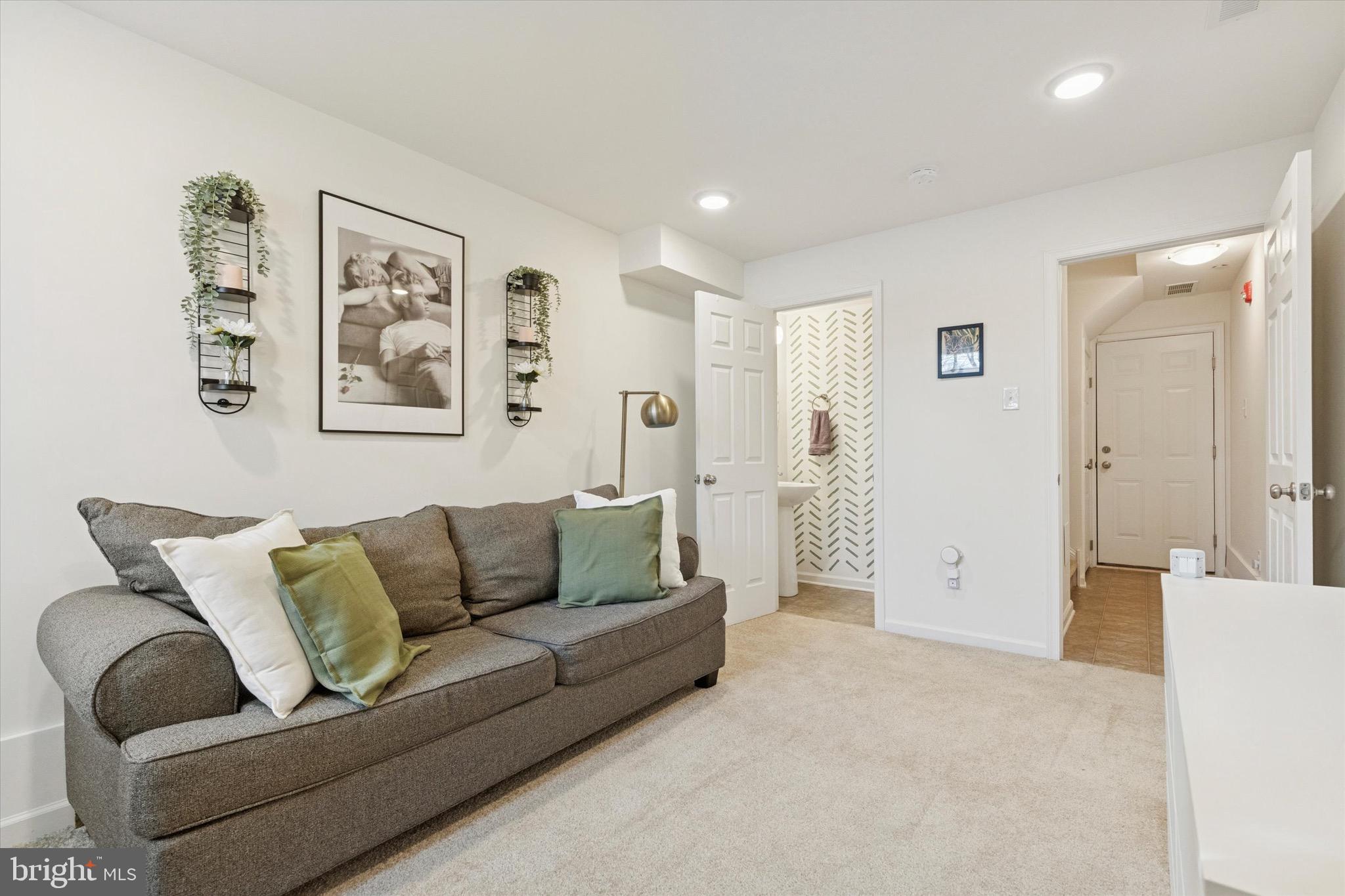 1529 DeKalb Street, Unit 131 Norristown, PA 19401 - Photo 22 of 27 a living room with furniture and a glass door