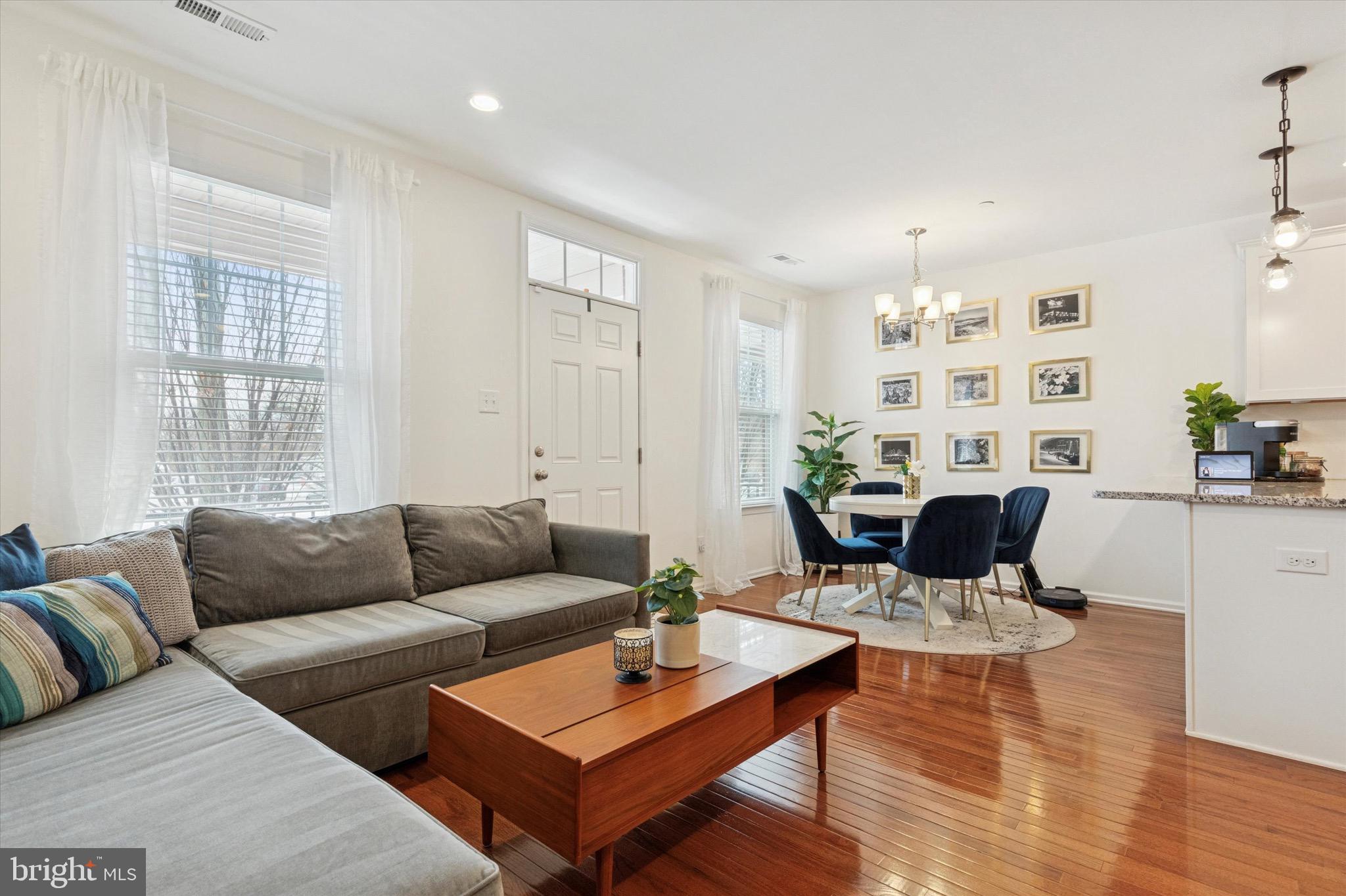 1529 DeKalb Street, Unit 131 Norristown, PA 19401 - Photo 4 of 27 a living room with furniture and wooden floor