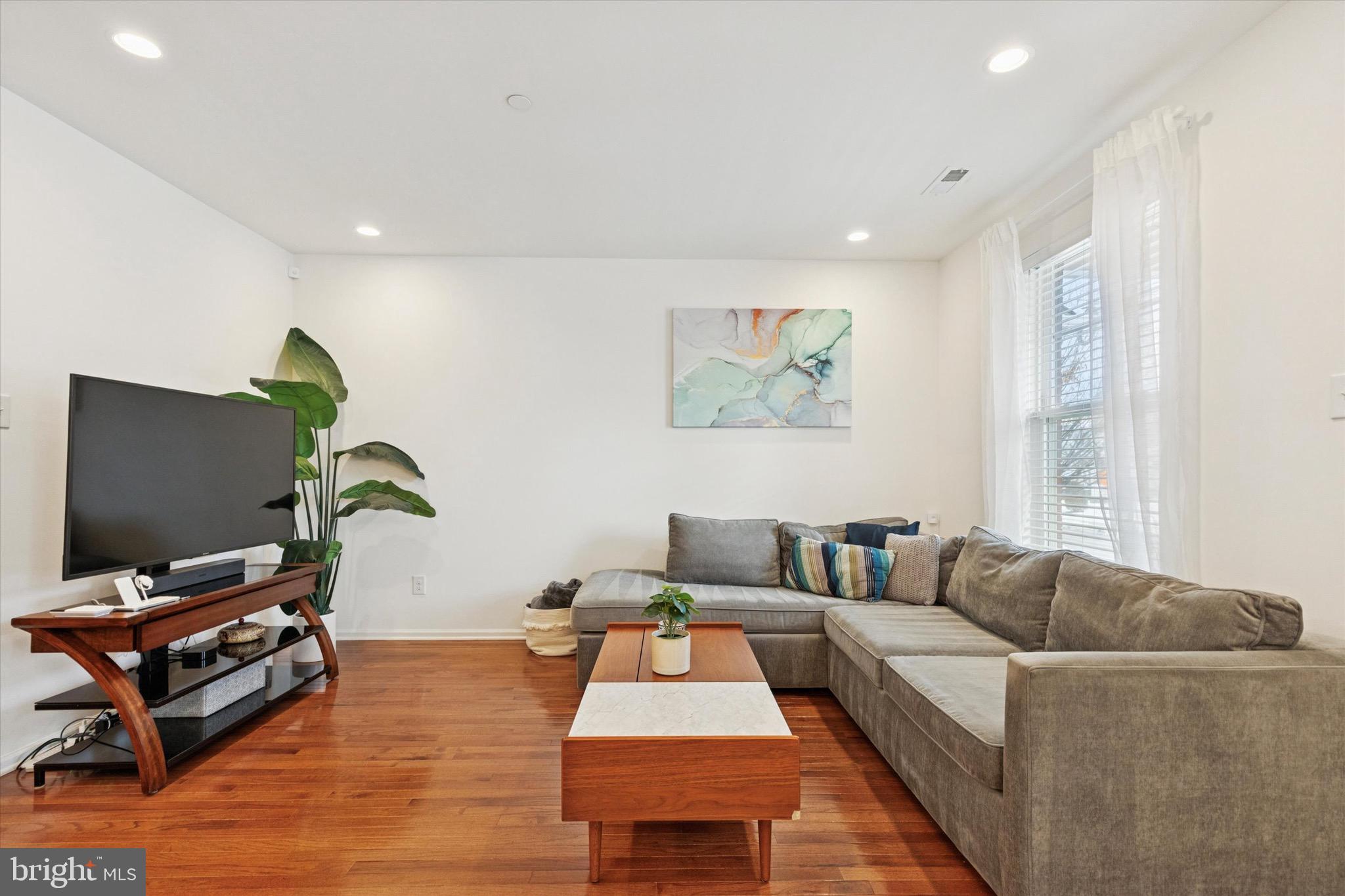 1529 DeKalb Street, Unit 131 Norristown, PA 19401 - Photo 6 of 27 a living room with furniture and a flat screen tv