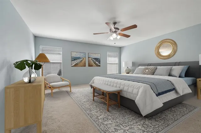 a bedroom with bed and a chandelier