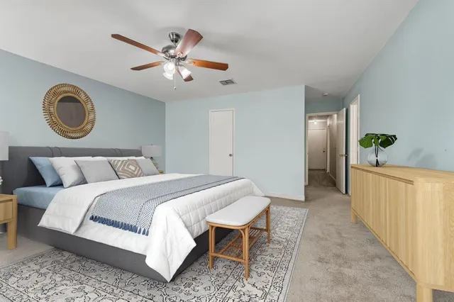 a bed room with a bed and a chandelier