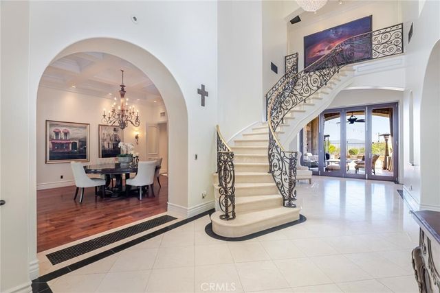 a dining room with furniture window and wooden floor
