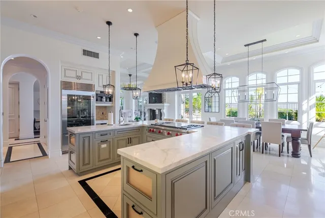a kitchen with sink cabinets and wooden floor