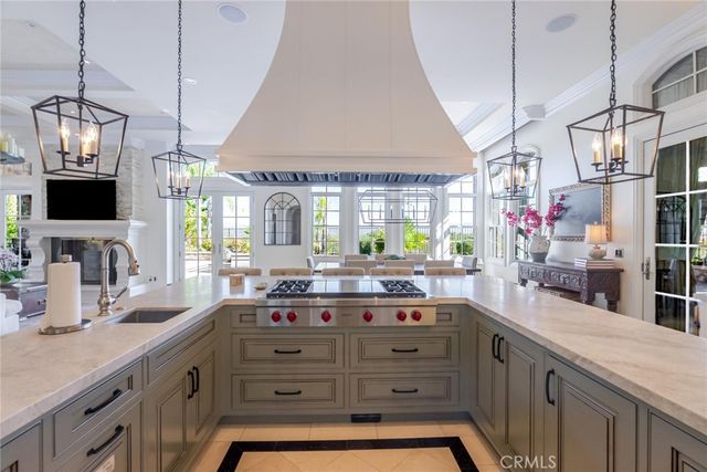 a bathroom with a granite countertop sink a mirror and shower